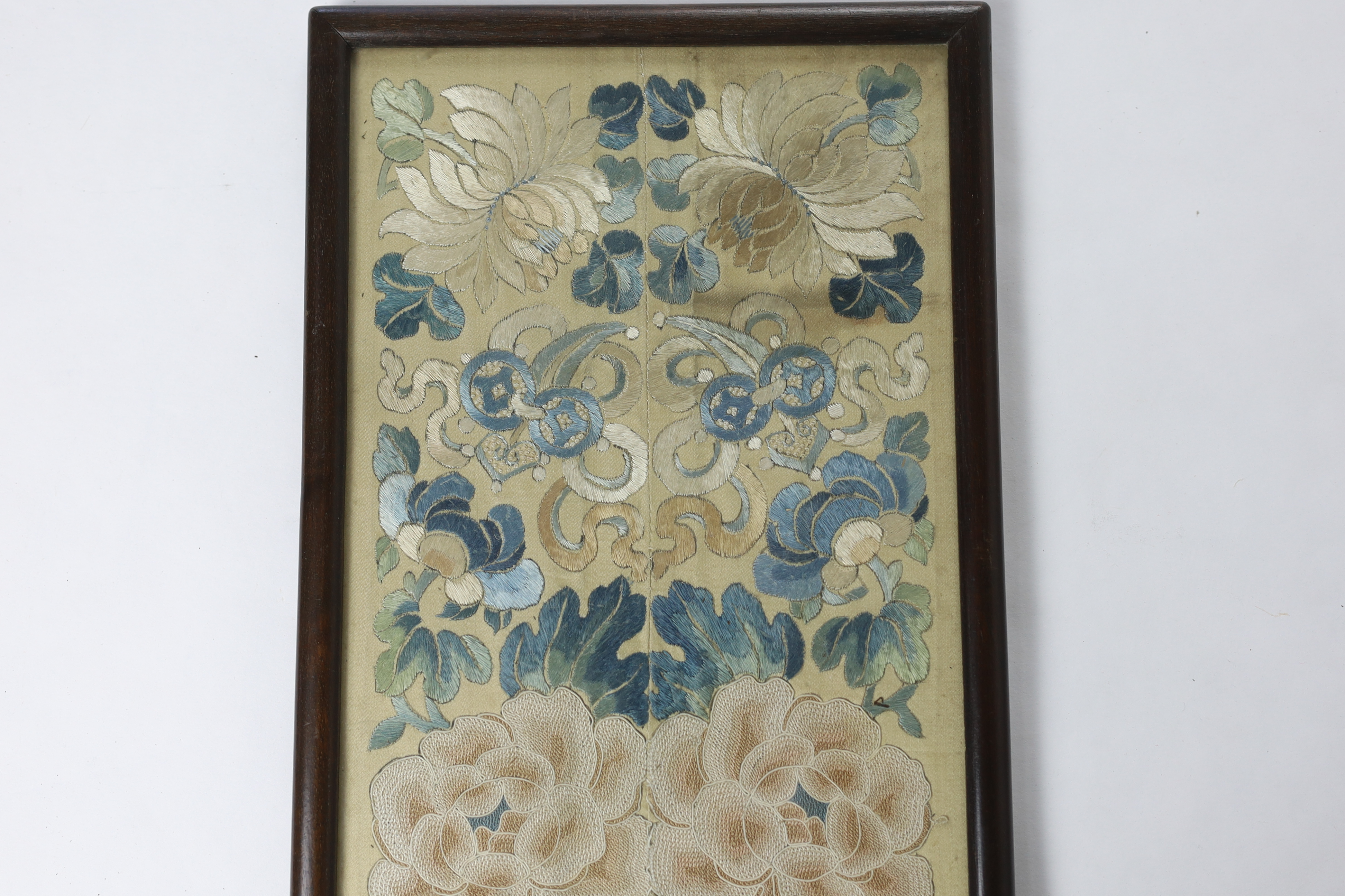 A pair of late 19th / early 20th century sleeve bands, framed together, worked in Chinese knot and stem stitch as flowers and auspicious symbols, 19cm wide x 49.5cm high